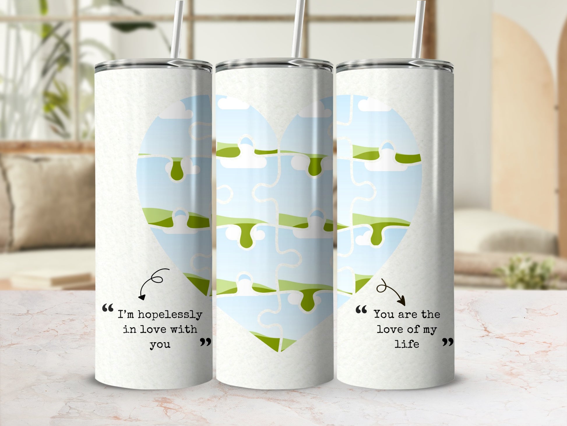 Three tumblers with a sky puzzle heart design and romantic quotes.