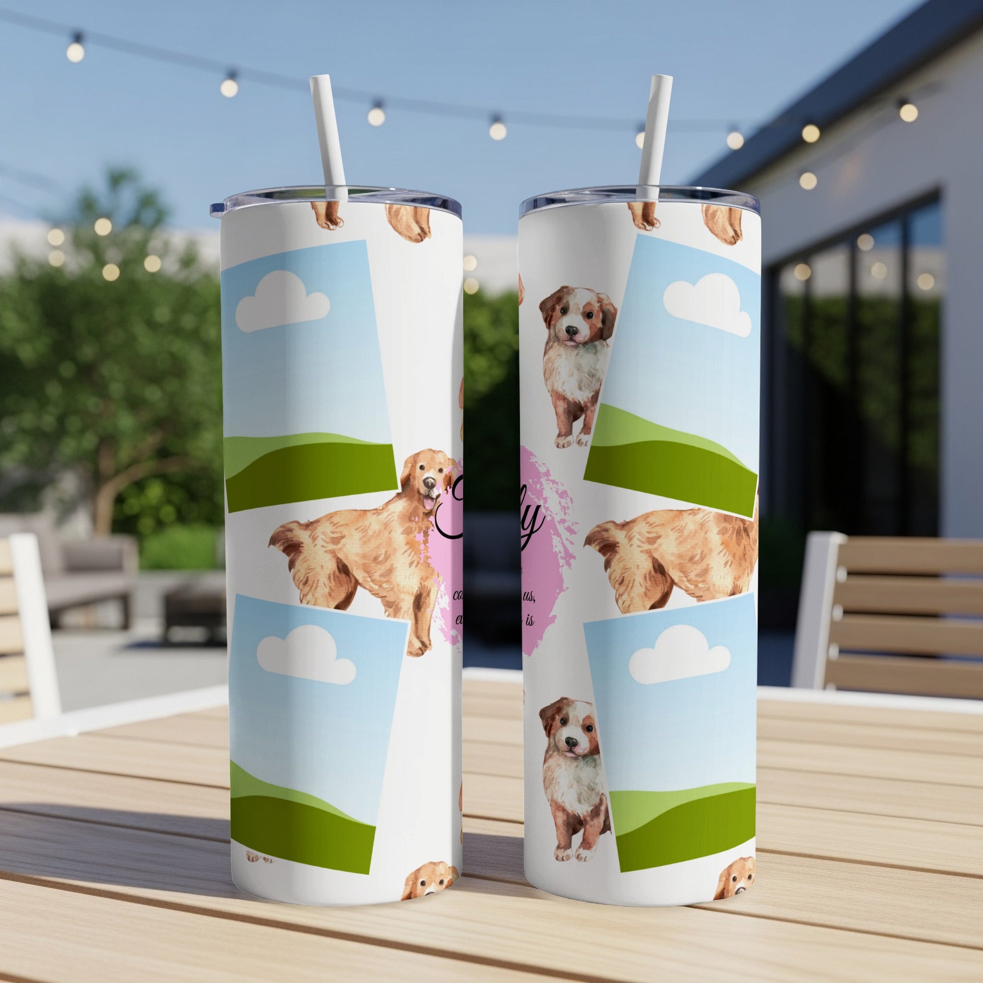Tumbler with watercolor dogs, clouds, and green hills on white background.