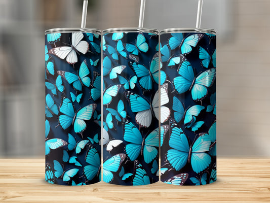 Blue and white butterflies cover a tumbler with a wood grain background.