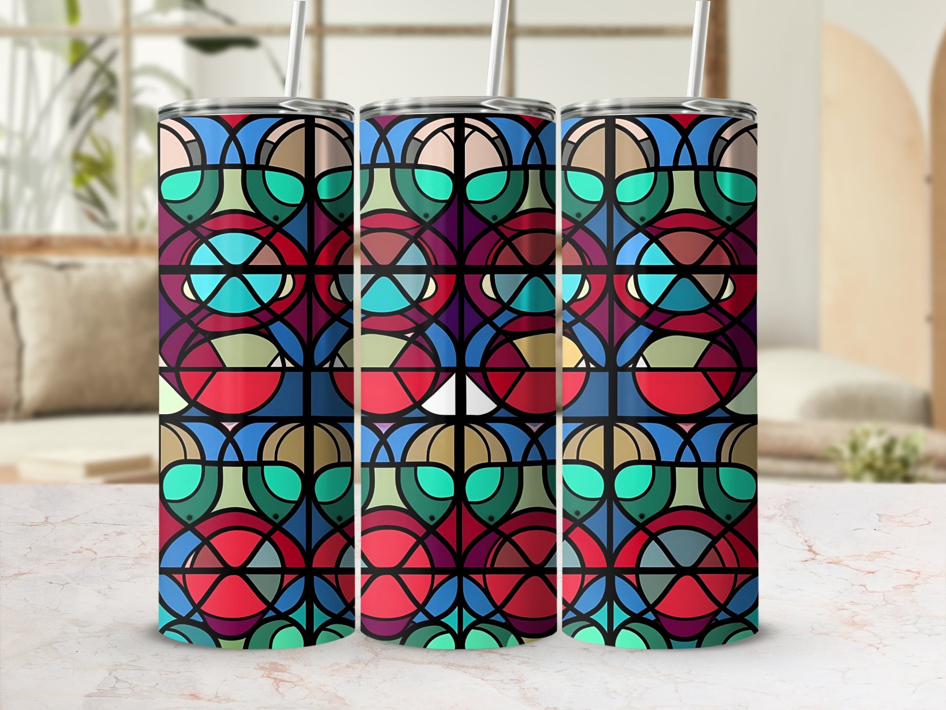 Stained glass pattern tumbler with straws, abstract geometric design.
