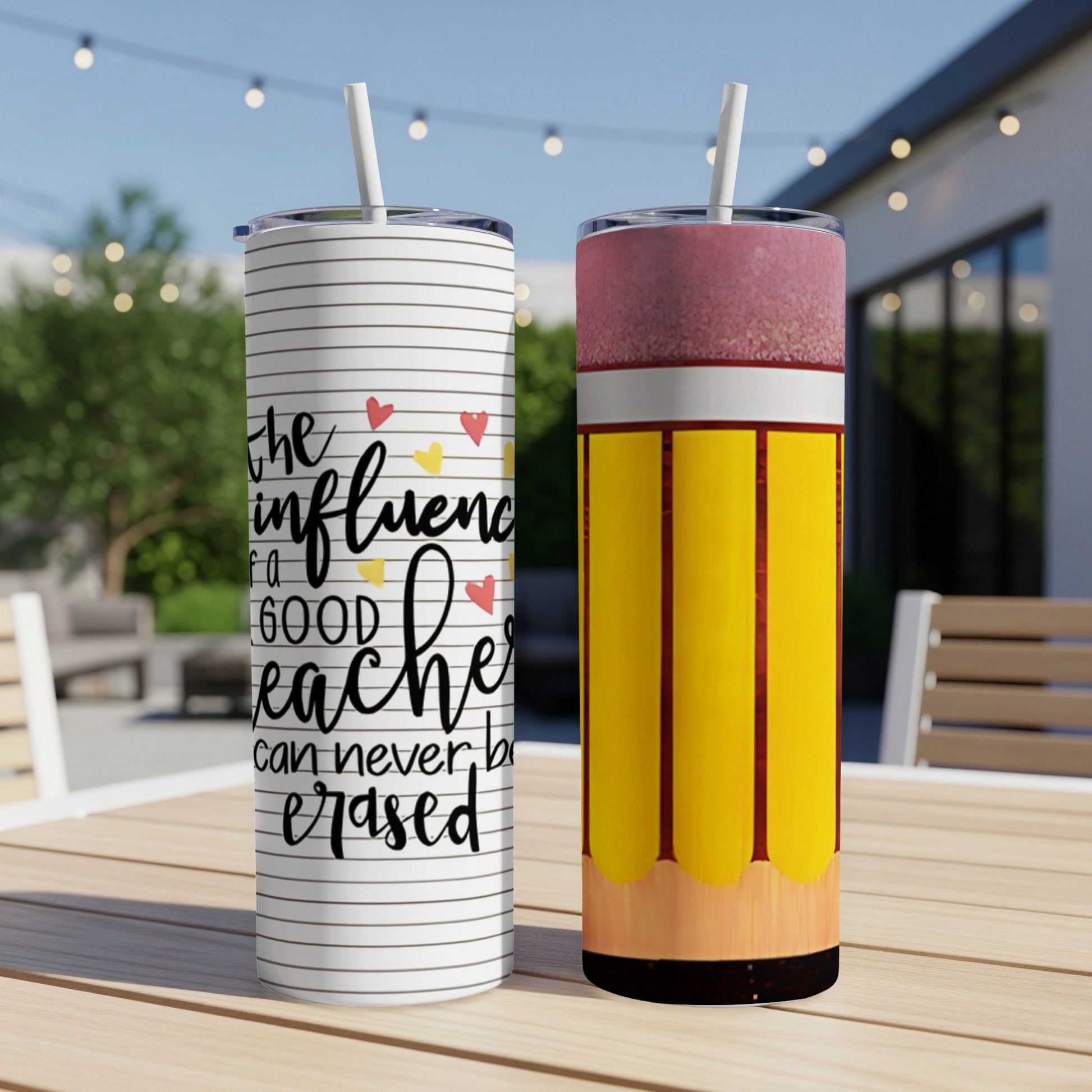 Two tumblers on a table, one with striped background and teacher quote, one with pencil design.