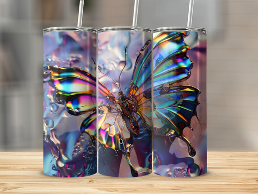 Three tumblers with iridescent butterfly designs and water droplets.