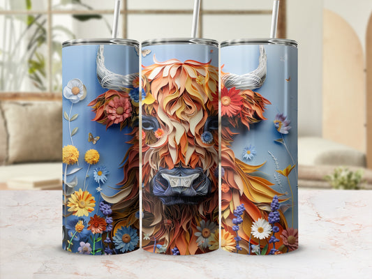 Highland cow with floral mane on a blue tumbler with straw.