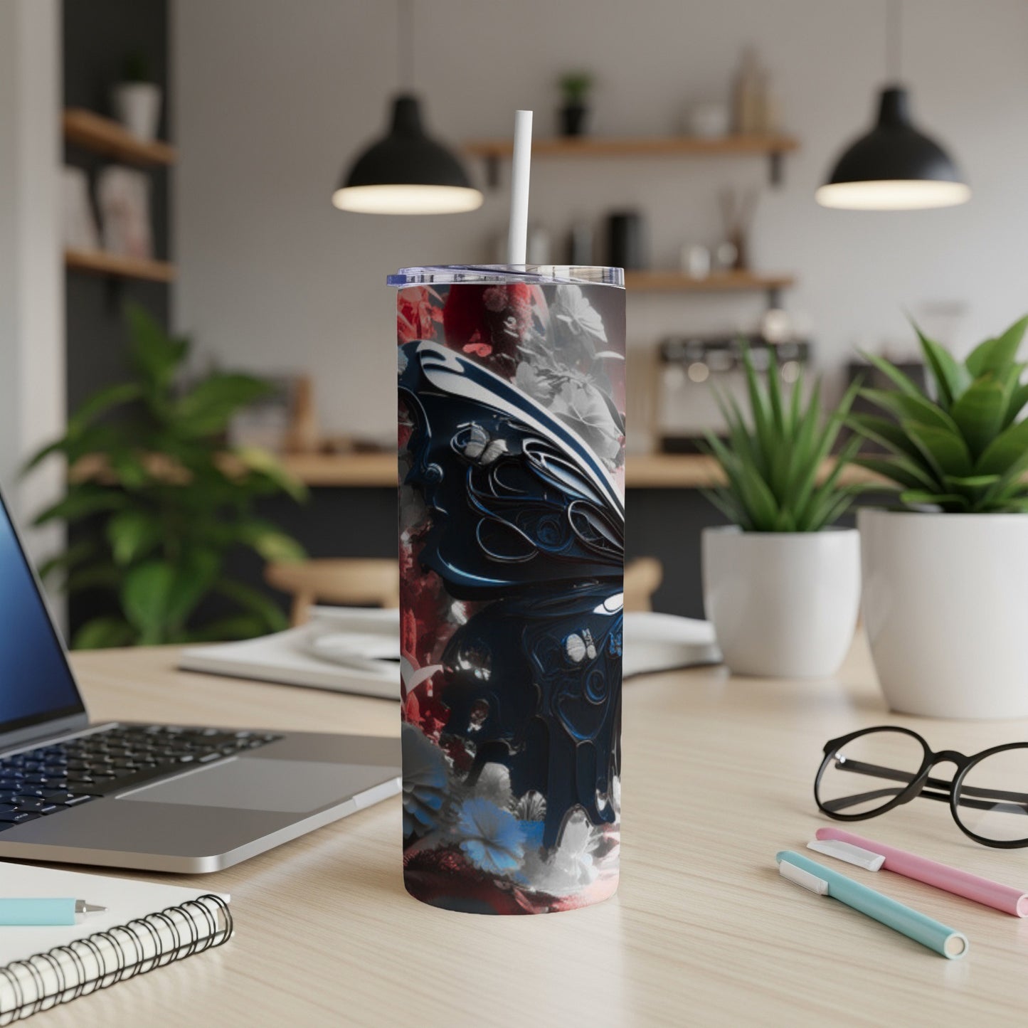 Abstract colorful butterfly design on a white tumbler with straw.