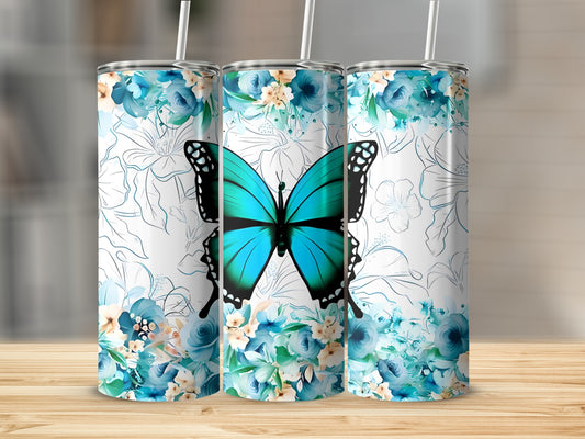 Blue butterfly and floral pattern on three white stainless steel tumblers.