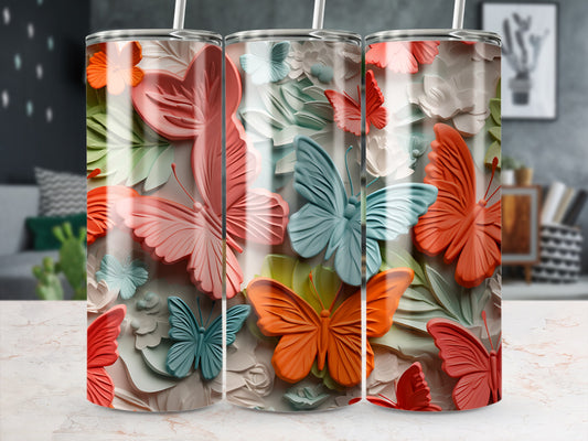 Three tumblers with raised butterfly designs in pastel and coral colors.