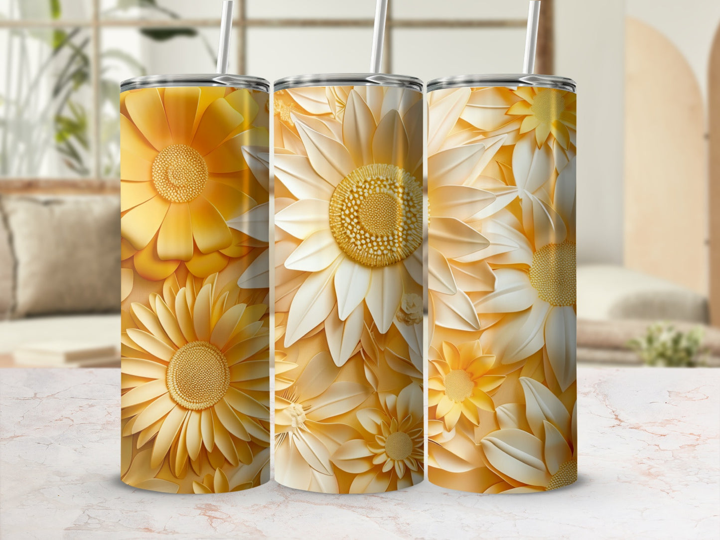 Three tumblers adorned with detailed yellow and white floral patterns.