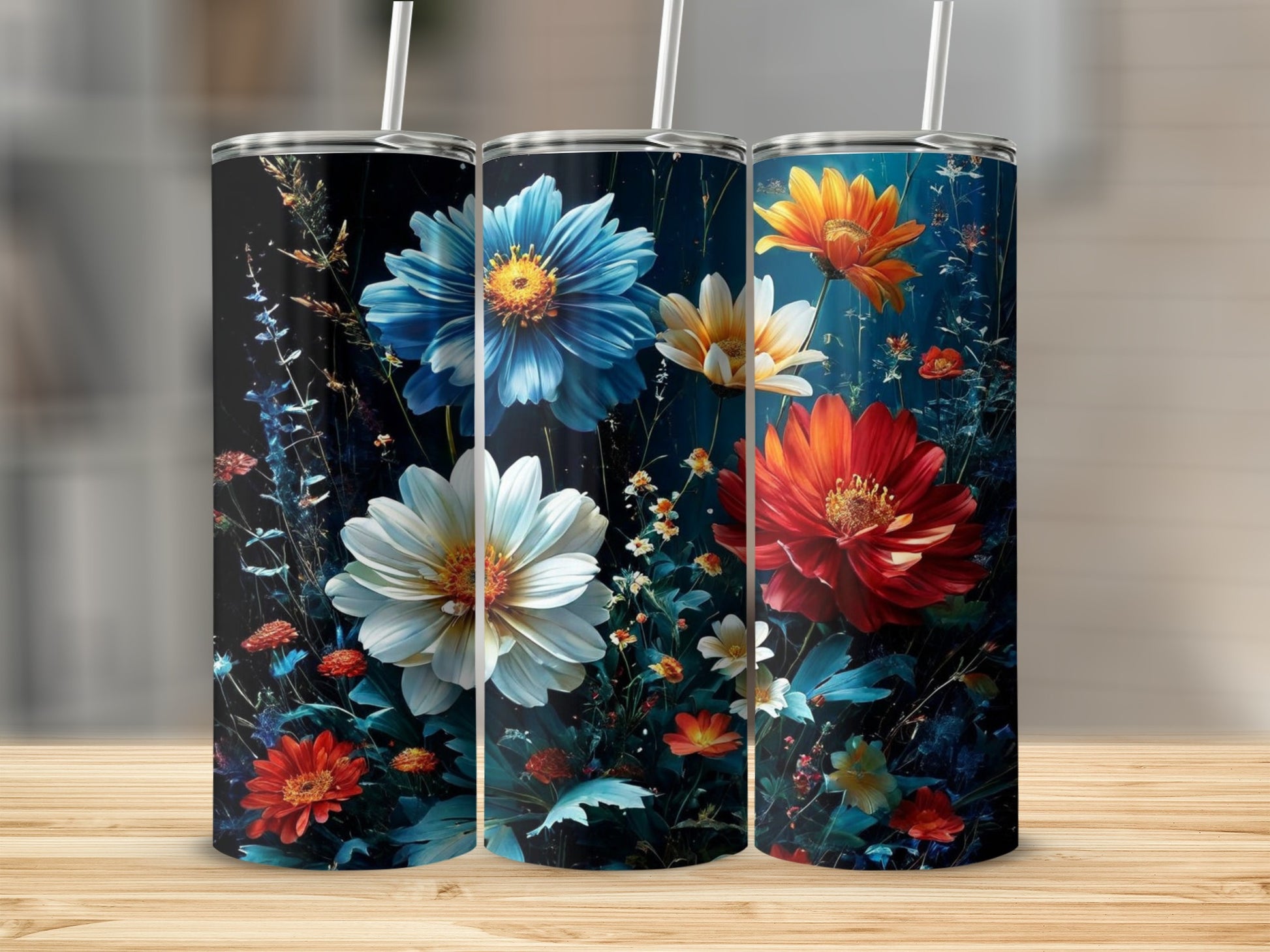 Three floral tumblers with blue, white, and red flowers on a dark background.