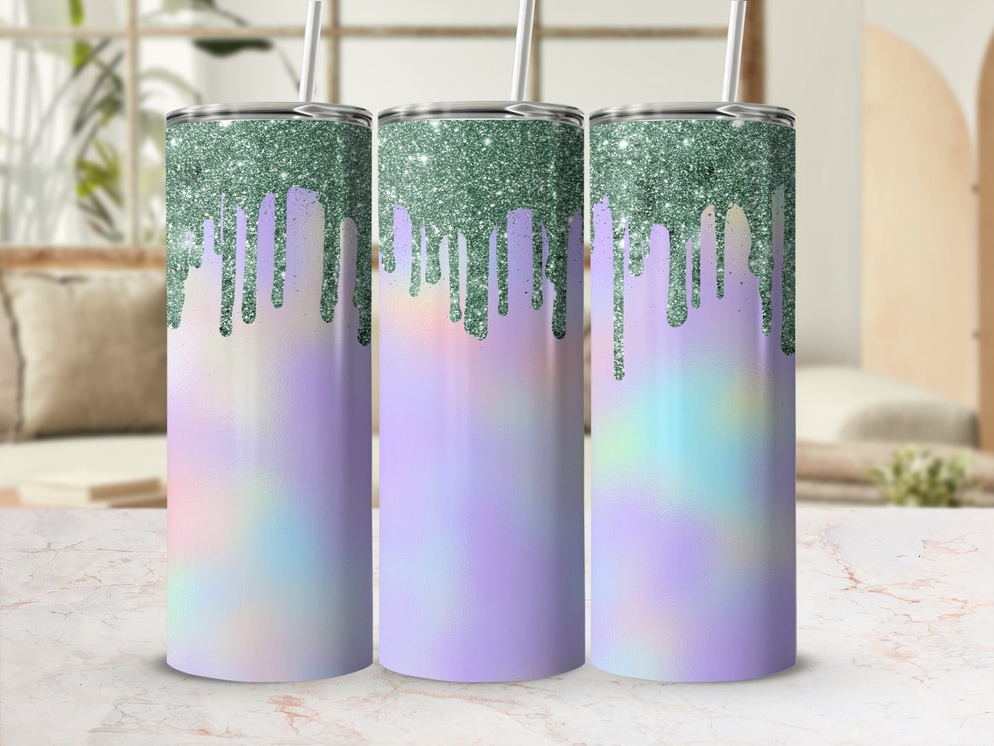 Three tumblers with dripping green glitter and pastel iridescent designs.