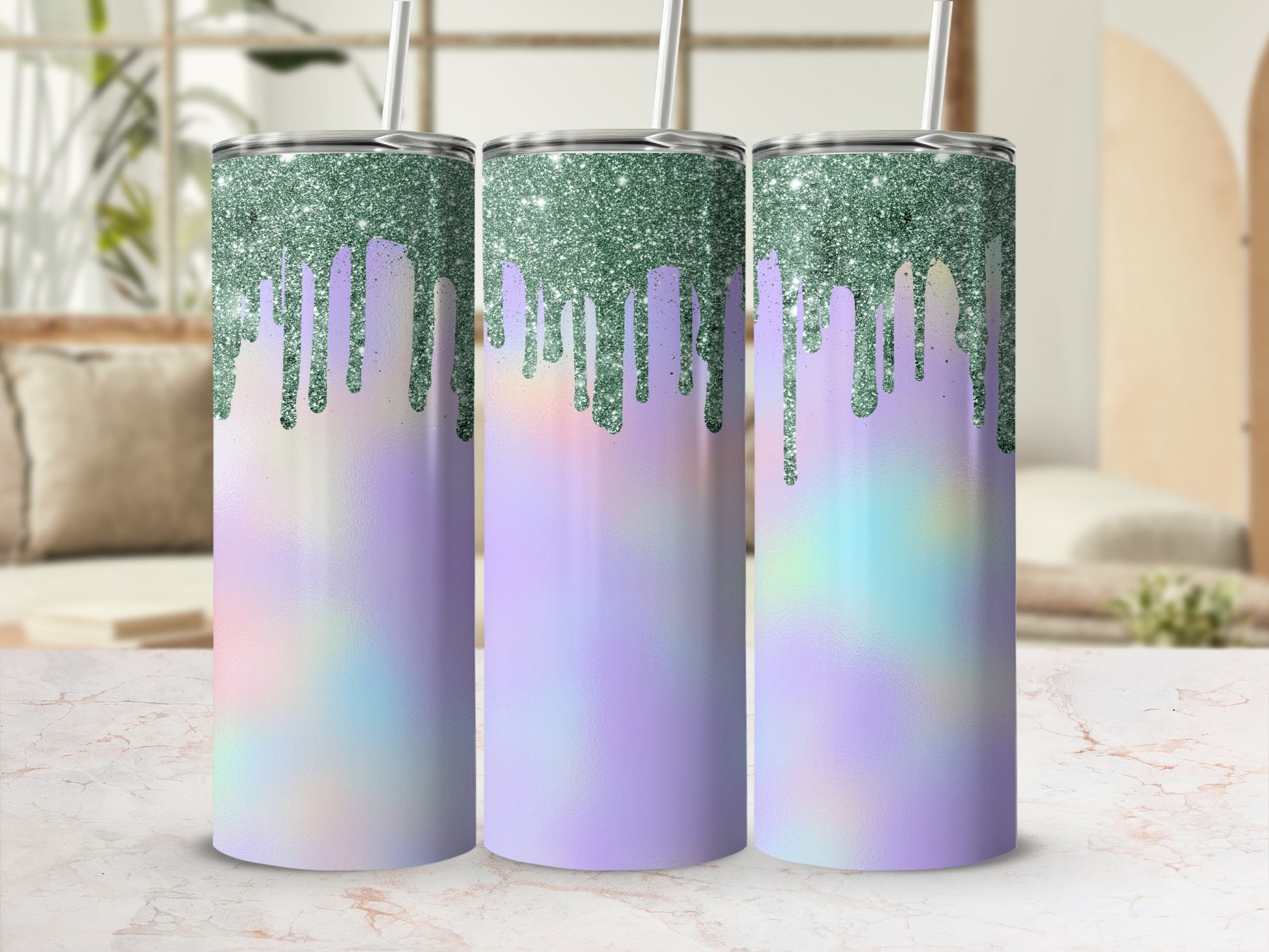 Three tumblers with dripping green glitter and pastel iridescent designs.