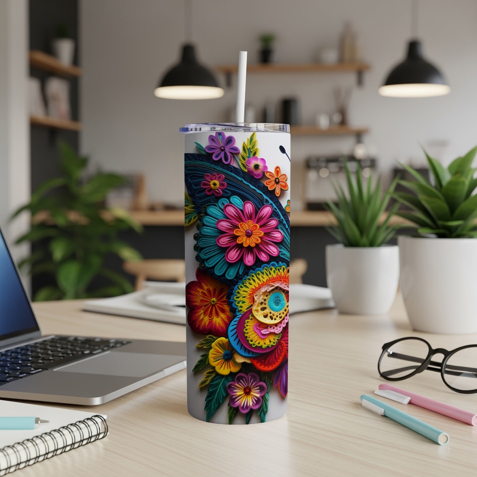 Colorful floral butterfly pattern on a white insulated tumbler with straw.
