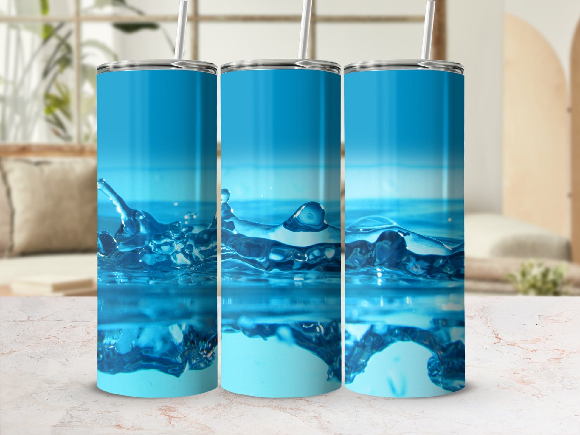 Three blue tumblers with water splash graphic.