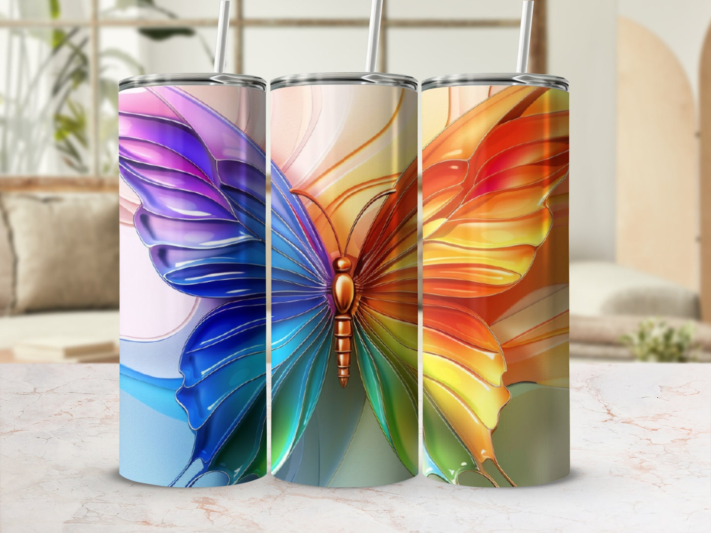 Three tumblers with butterfly wing designs in various colorful gradients.