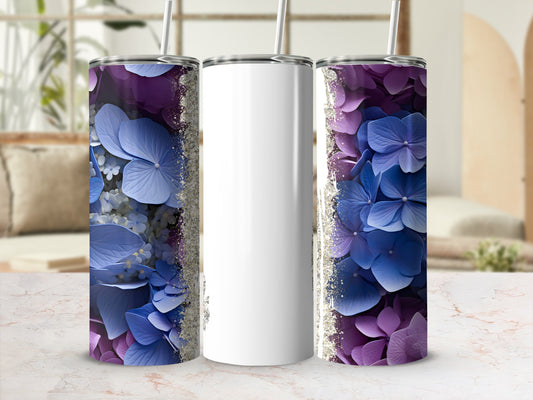 White tumbler with purple and blue hydrangea floral design and glitter accents.
