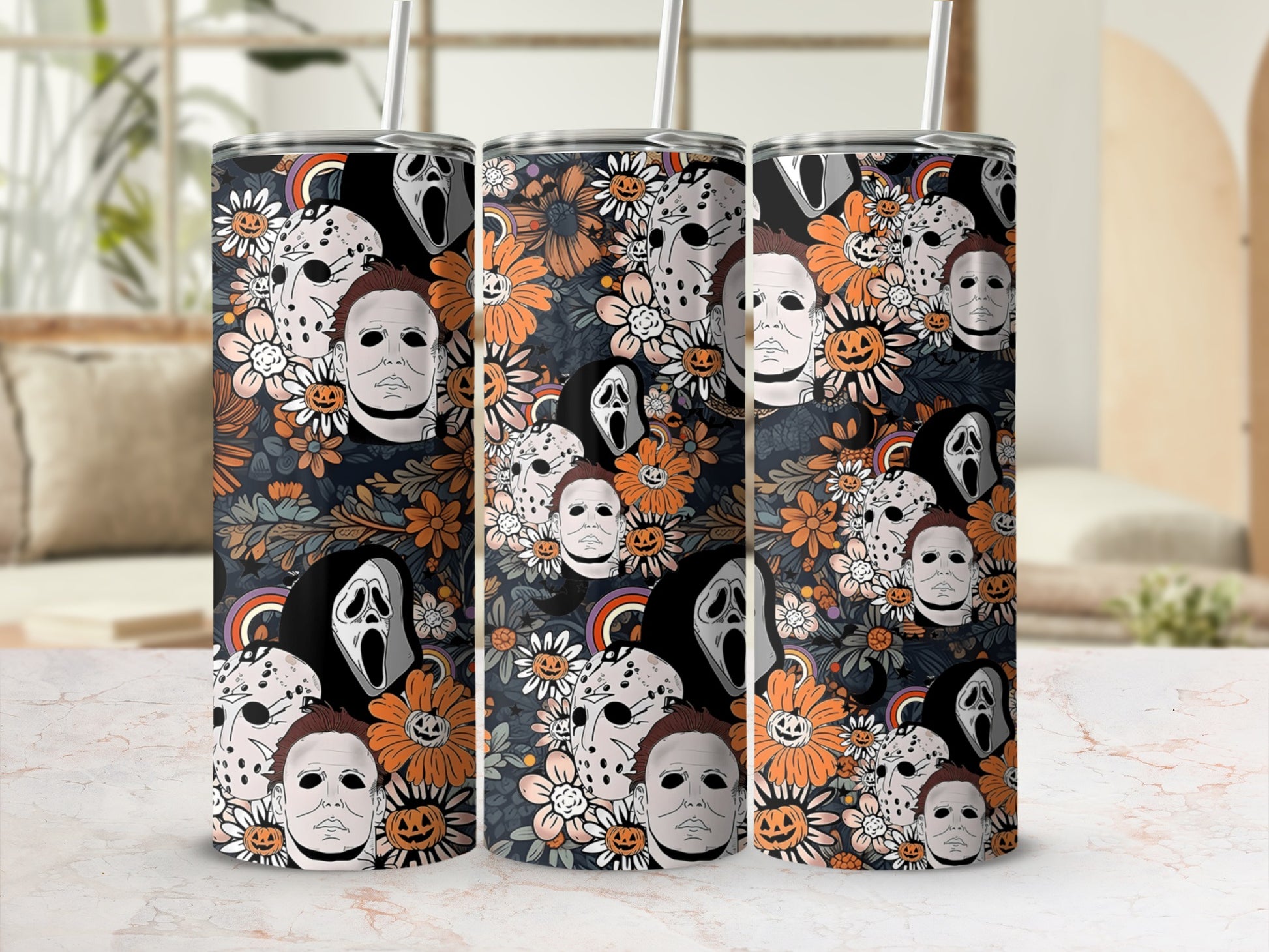 Tumbling tower of Halloween themed tumblers with horror movie characters and floral patterns.