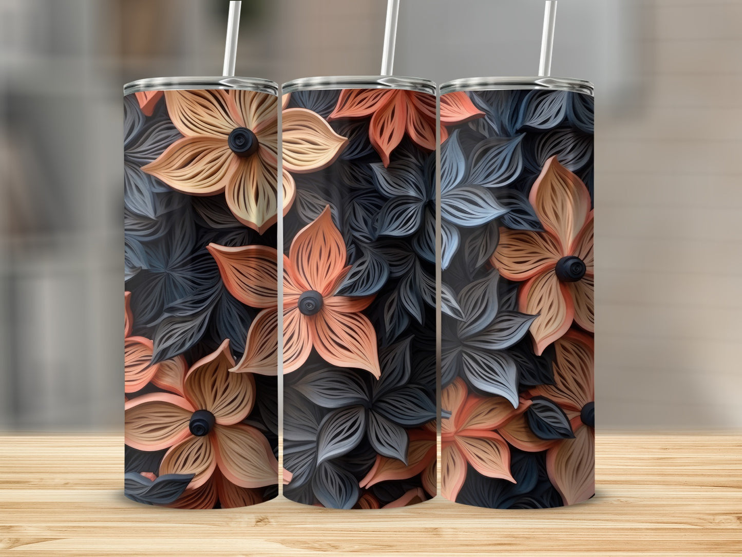 Three tumblers with a repeating pattern of peach and dark blue floral designs.