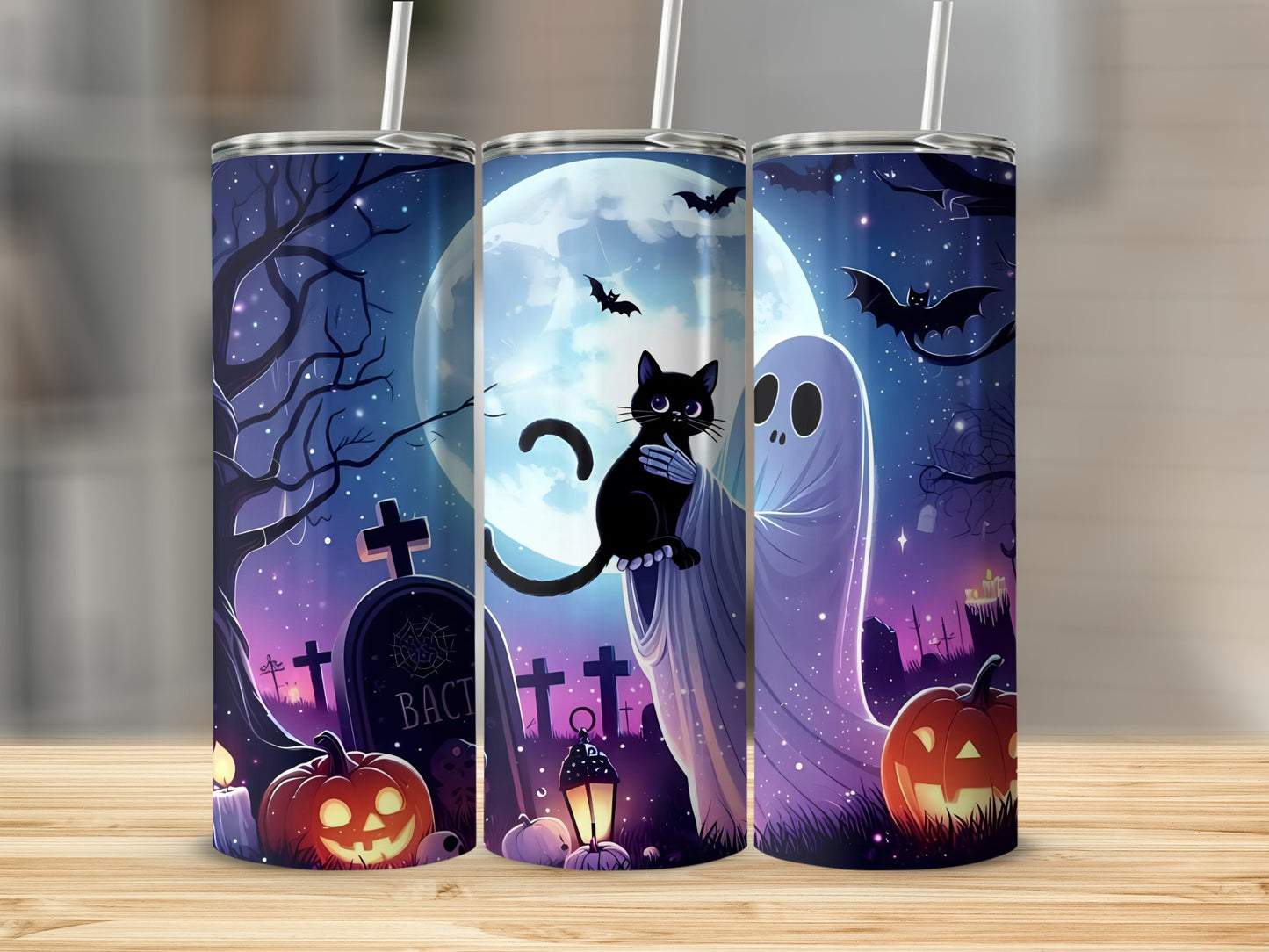Halloween tumblers with black cat, ghost, pumpkins, and gravestones under a full moon.