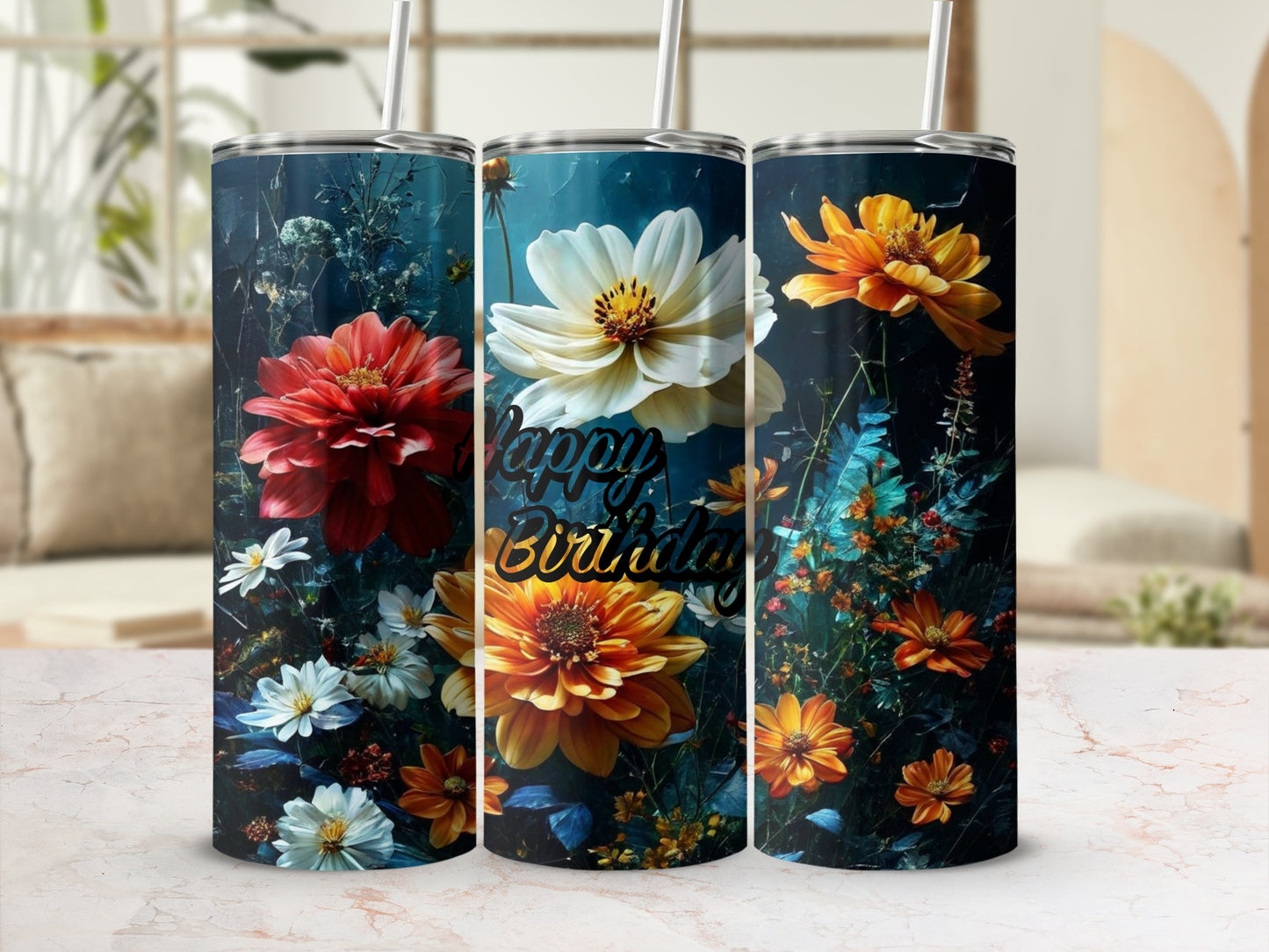 Three floral tumblers, two with "Happy Birthday" text, against a blurred background.