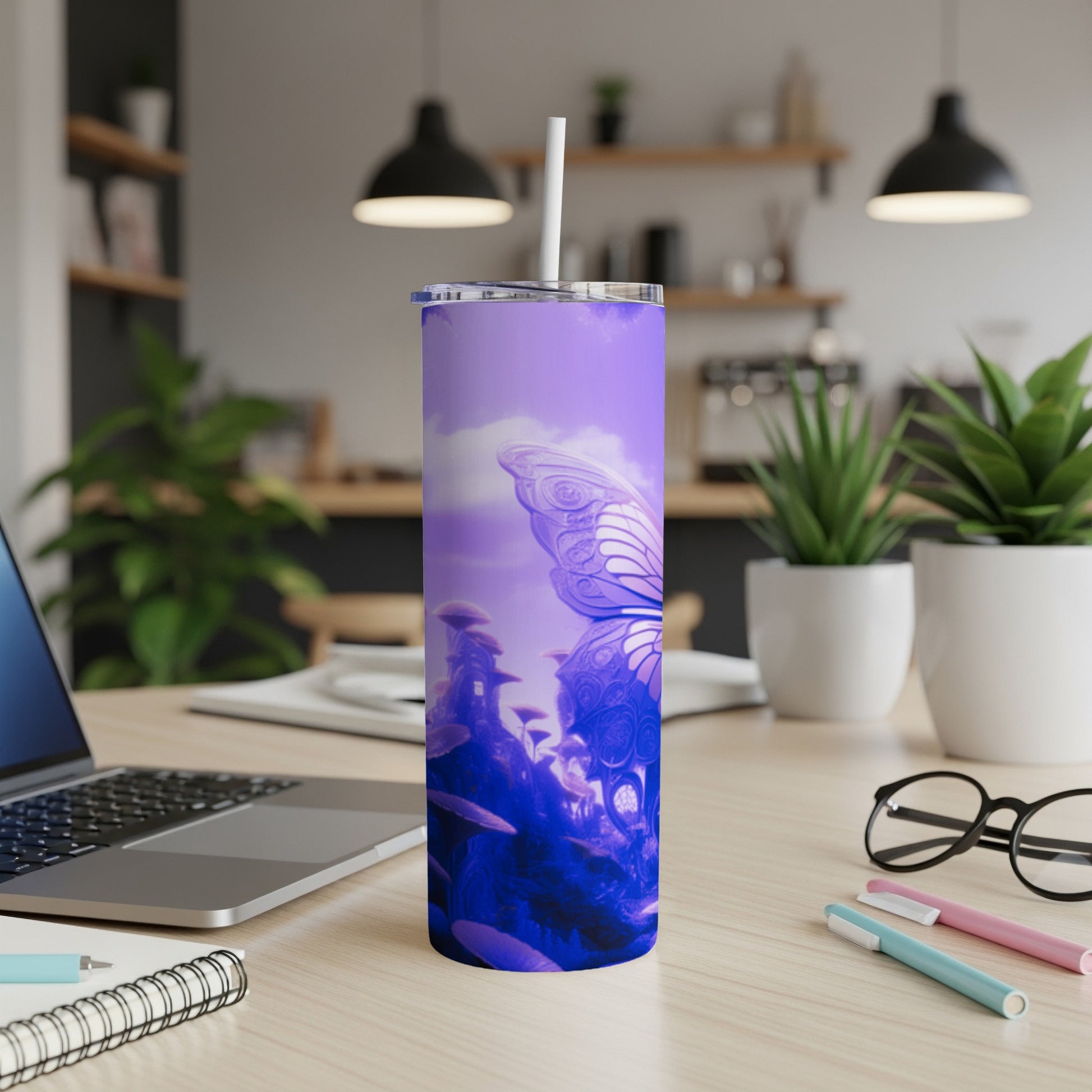 Purple tumbler with butterfly and fantastical landscape design.