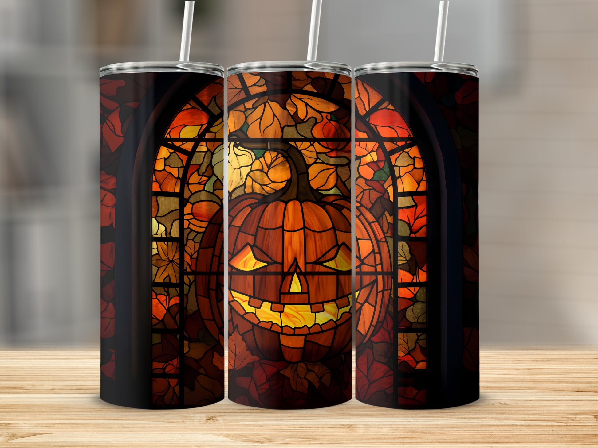 Stained glass pumpkin jack-o'-lantern tumbler with straws.