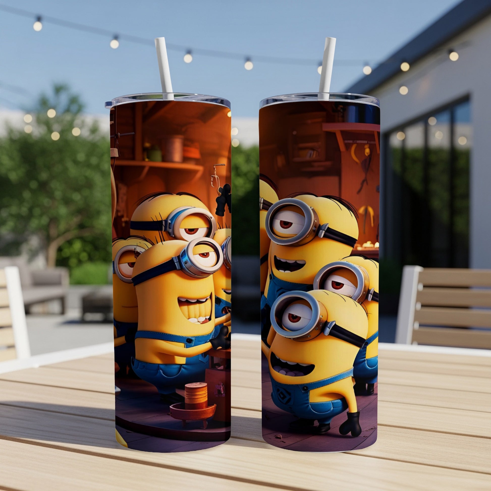 Minions characters smiling on a tumbler with straw, set on a table outdoors.