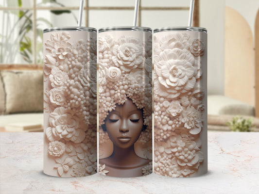 3D relief tumbler with woman's face emerging from floral and beaded hair.