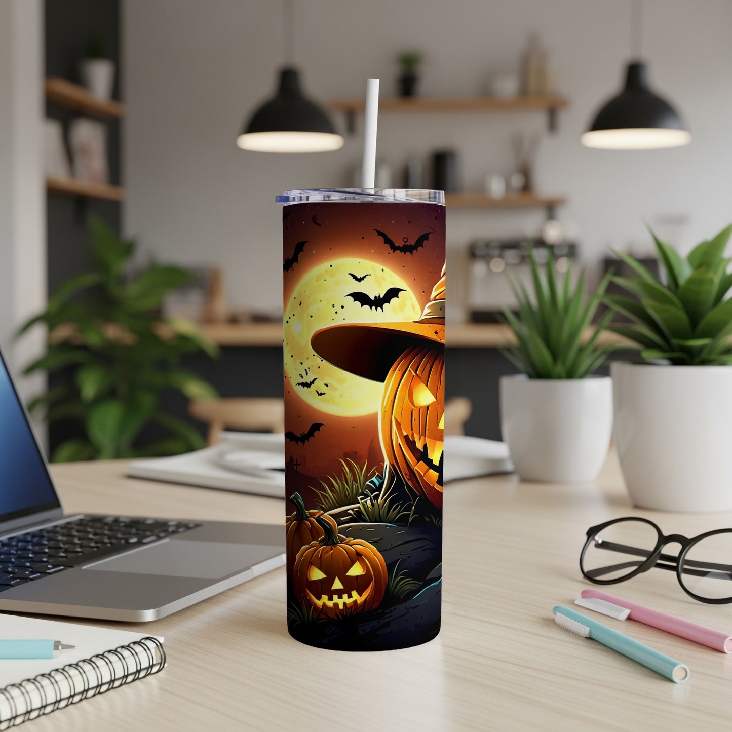 Tall tumbler with Halloween design featuring jack-o'-lanterns, bats, and a full moon.