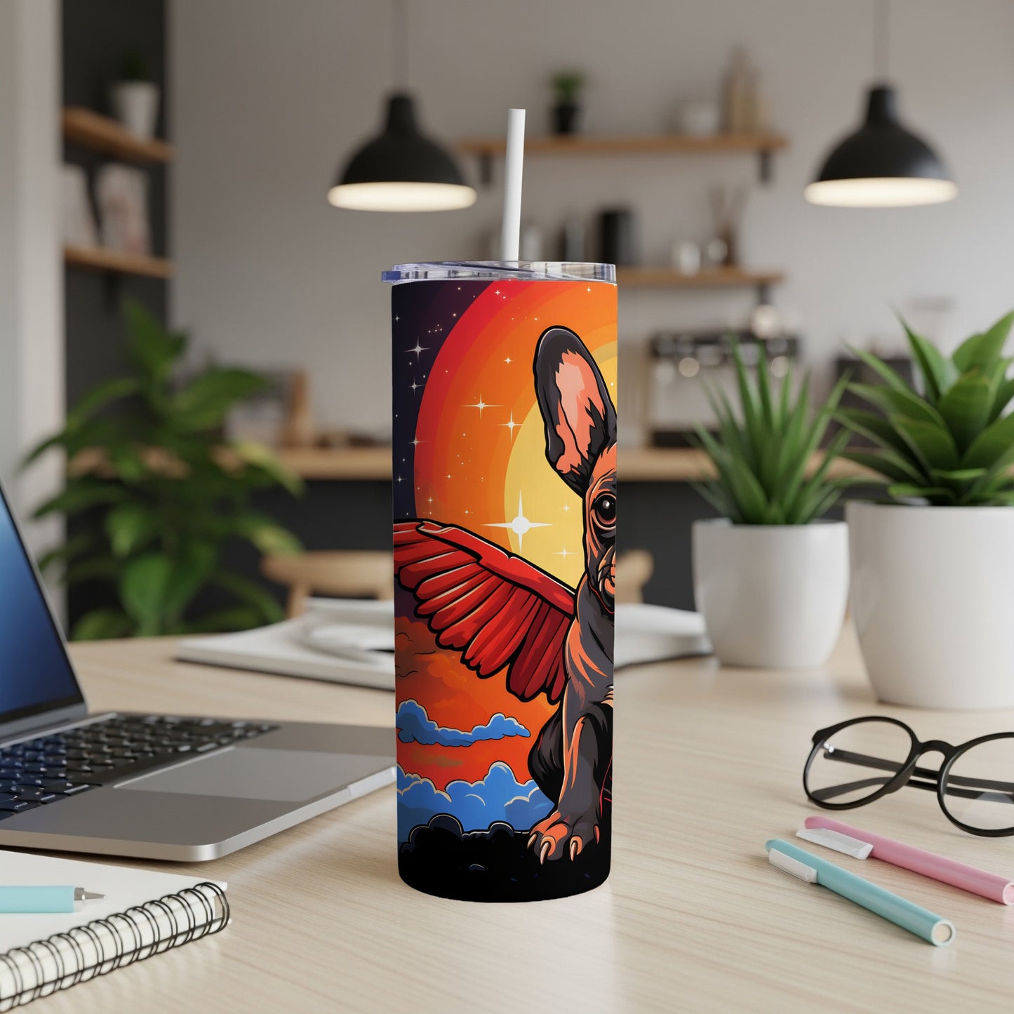 Tumbler featuring a French bulldog with wings against a vibrant sunset.