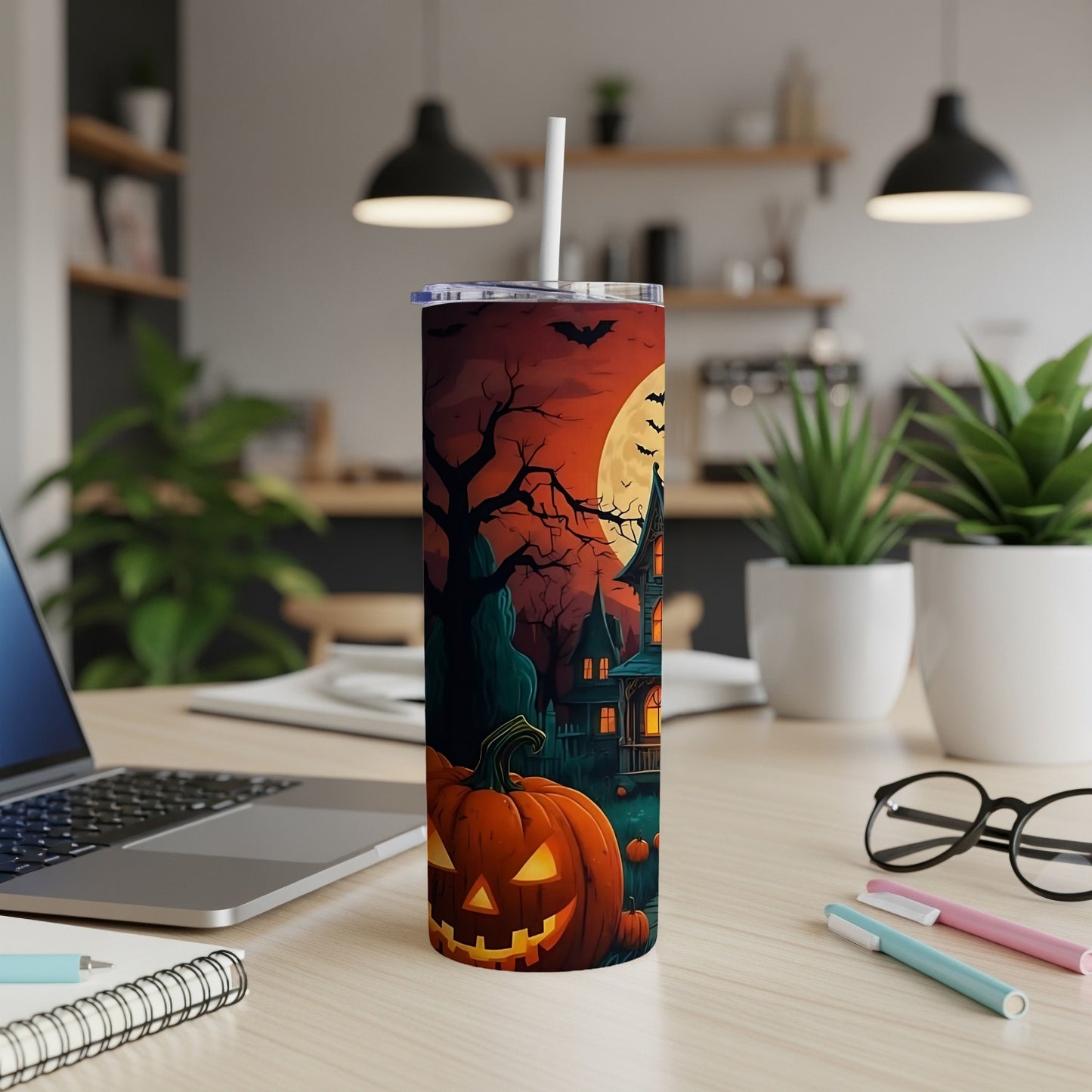 Tumbler with Halloween scene featuring jack-o'-lantern, haunted house, bats, and full moon.
