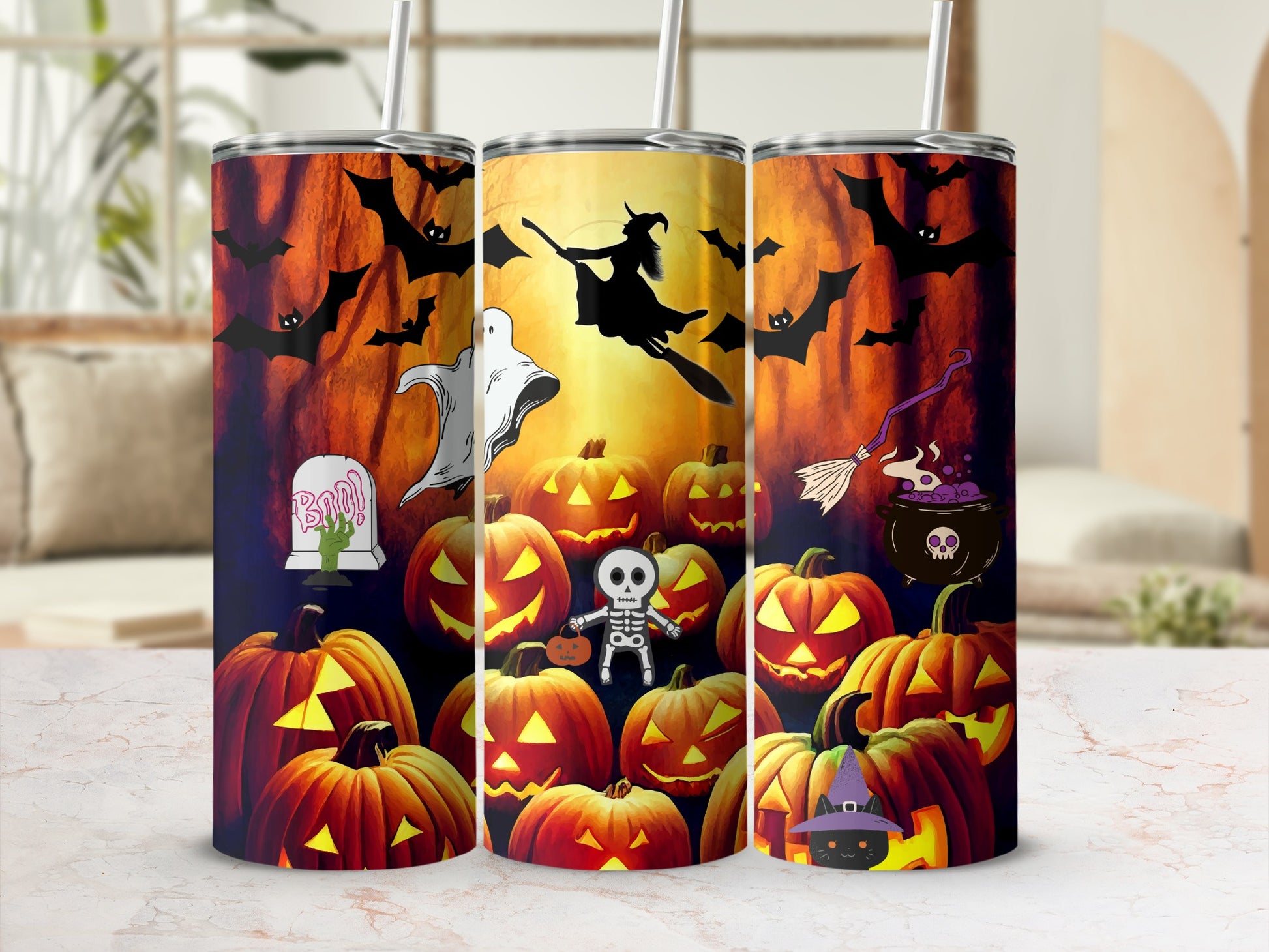 Three tumblers with Halloween-themed designs featuring pumpkins, bats, a ghost, witch, and skeleton.