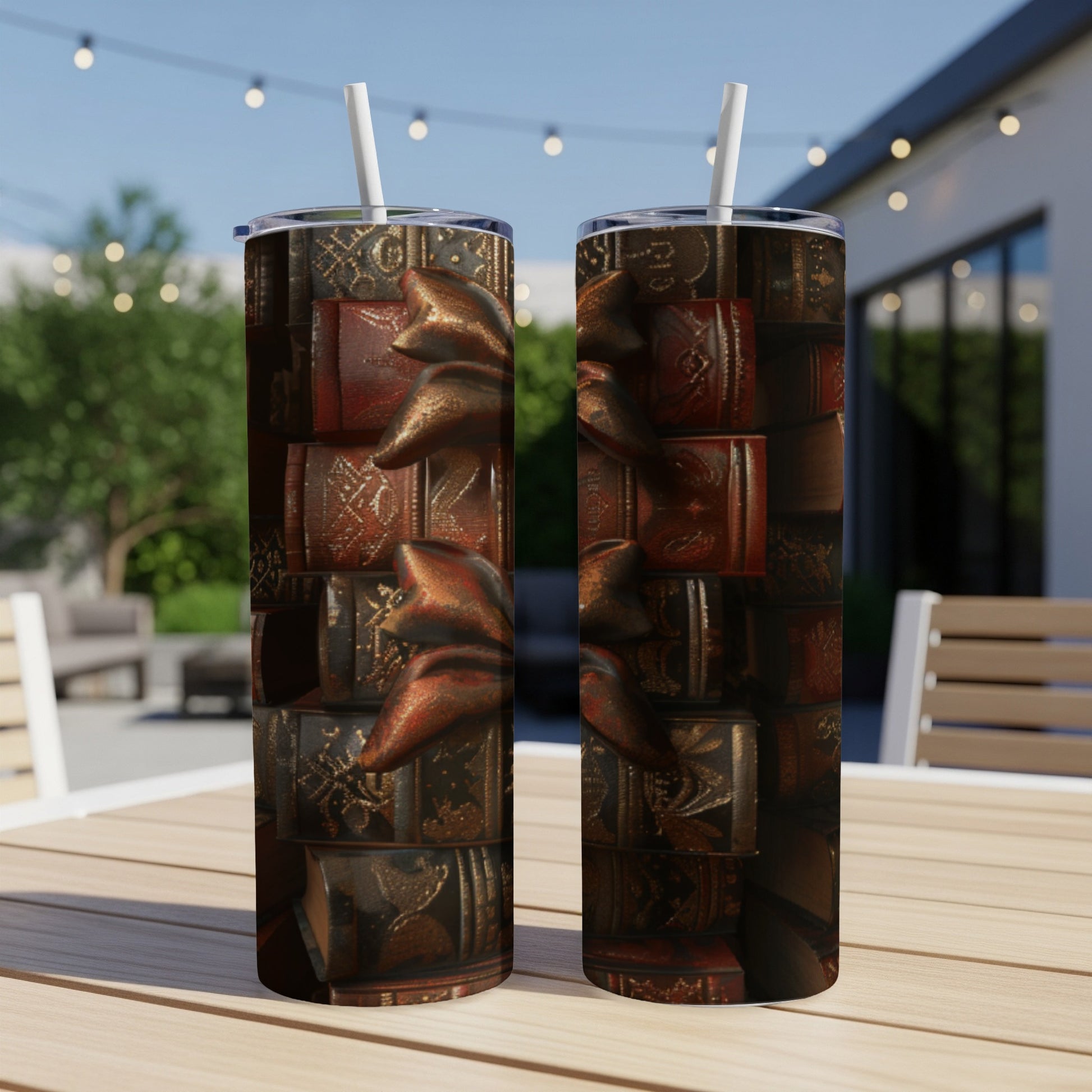 Two tumblers with a dark, antique book design and a bronze ribbon.