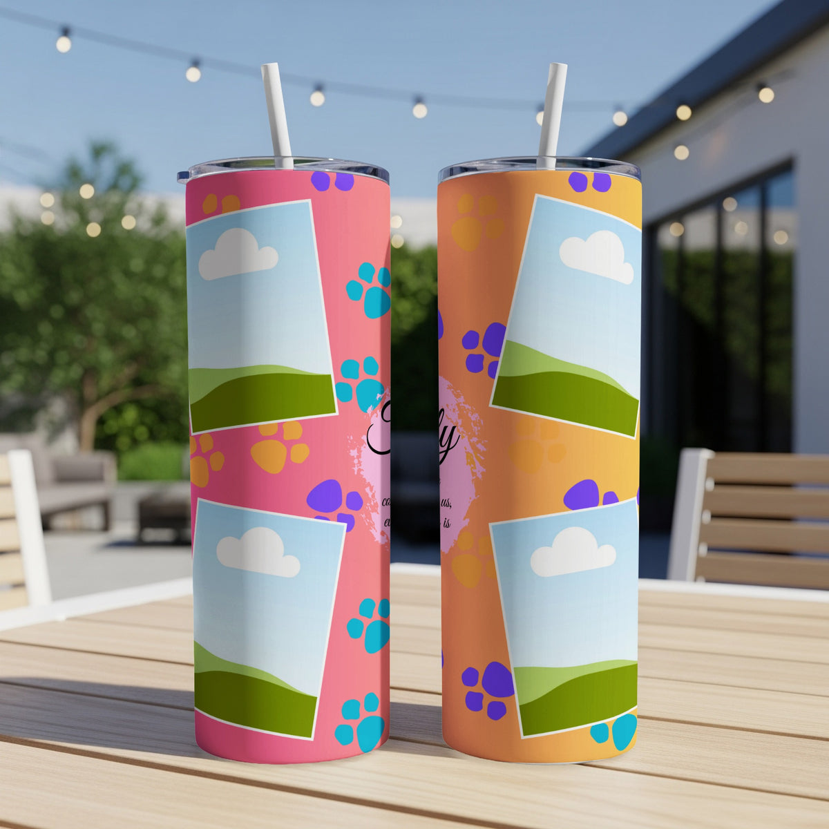 Two tumblers with customizable photo slots and paw print designs on a table.