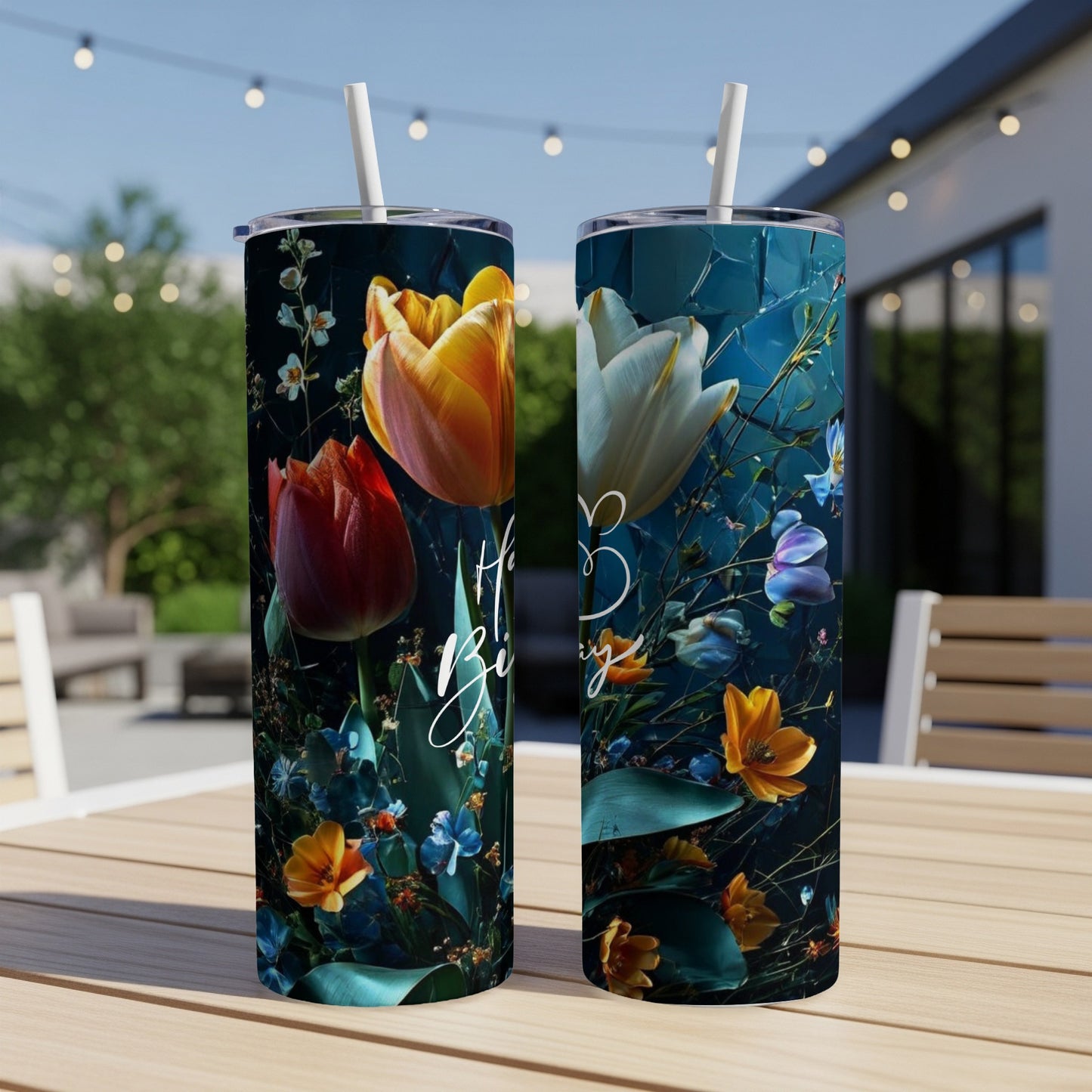 Two tall tumblers with red, orange, and yellow floral designs.