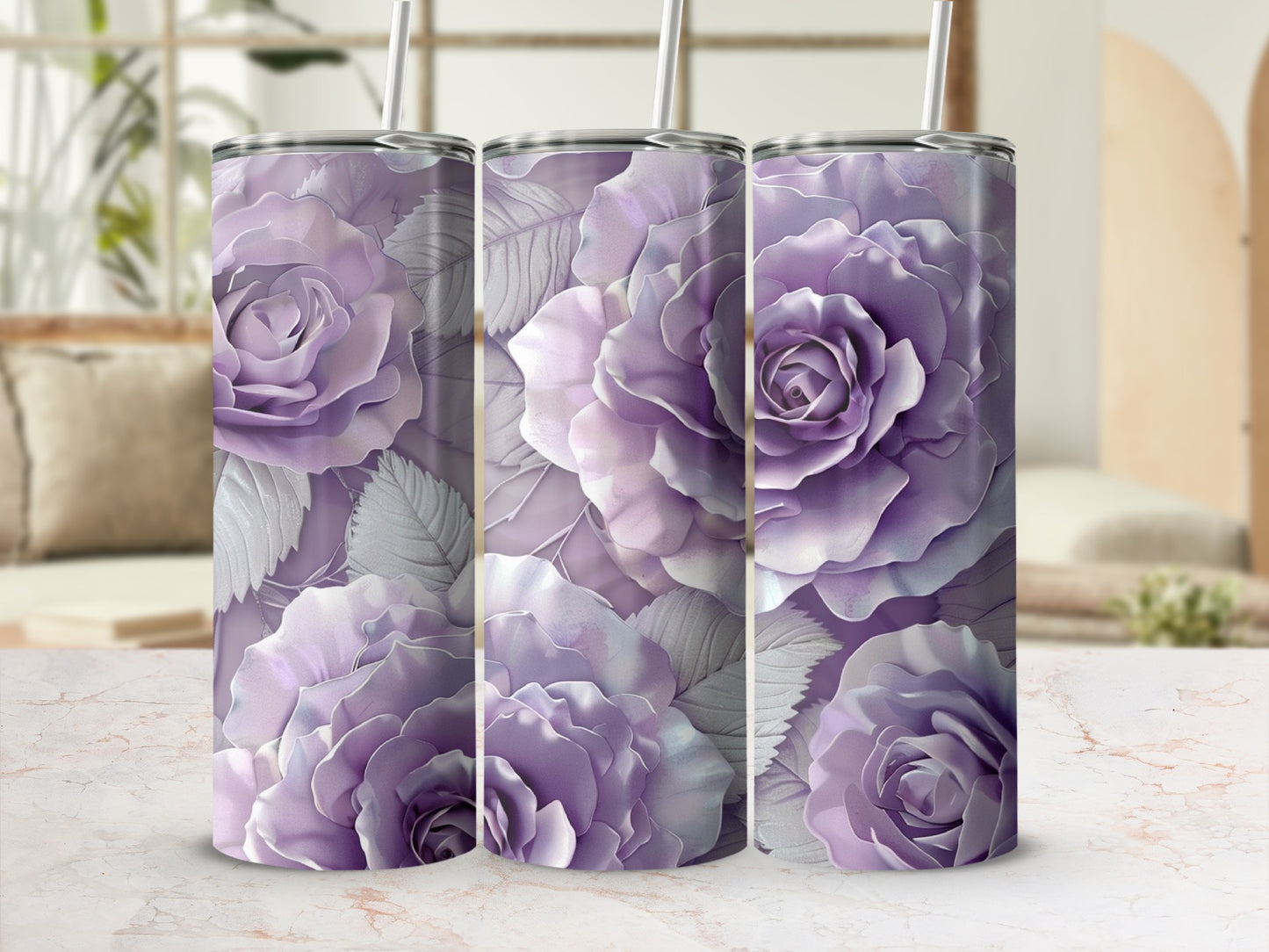 Three purple rose patterned tumblers with straws on a patterned surface.