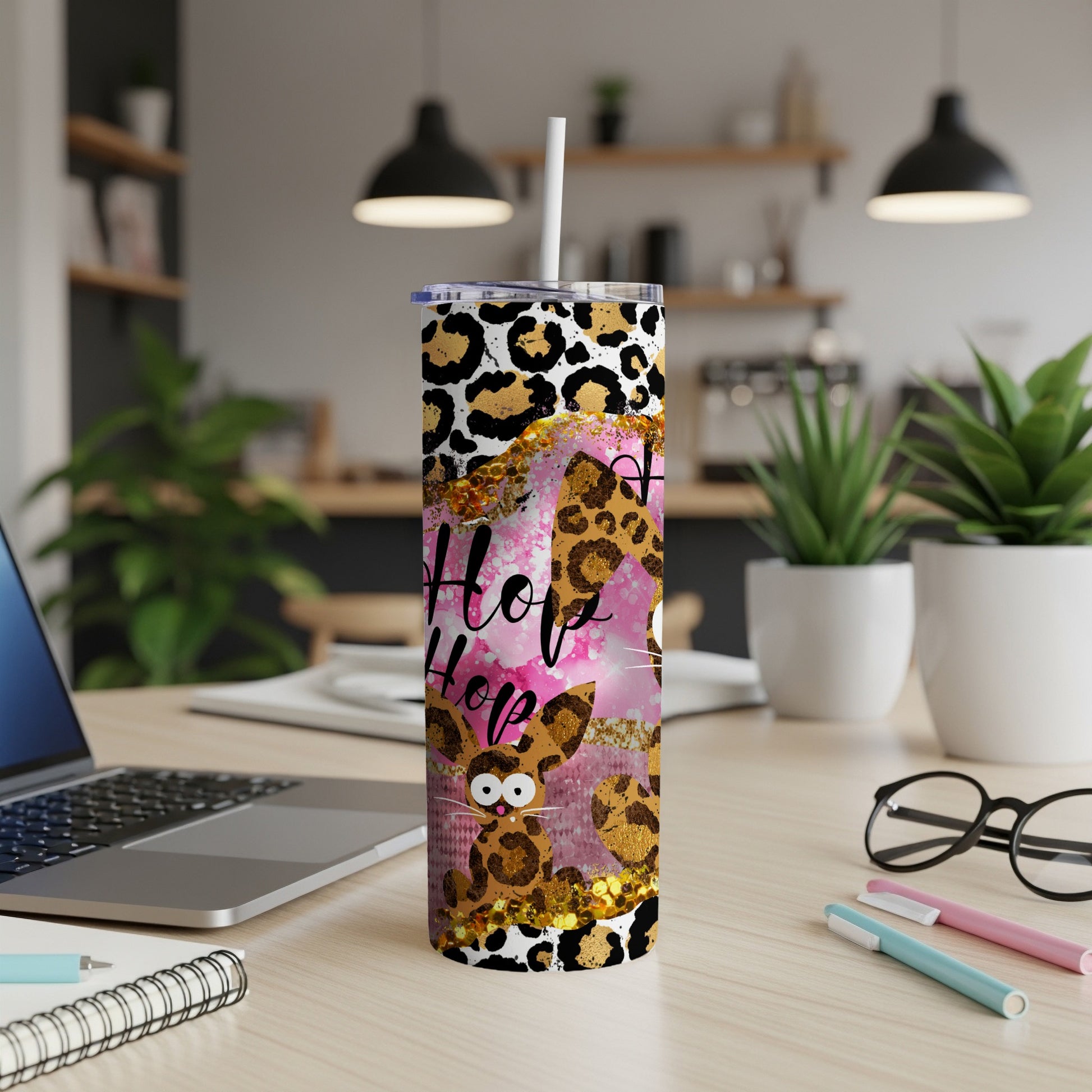 Leopard print tumbler with "Hop Hop" text and a bunny design.