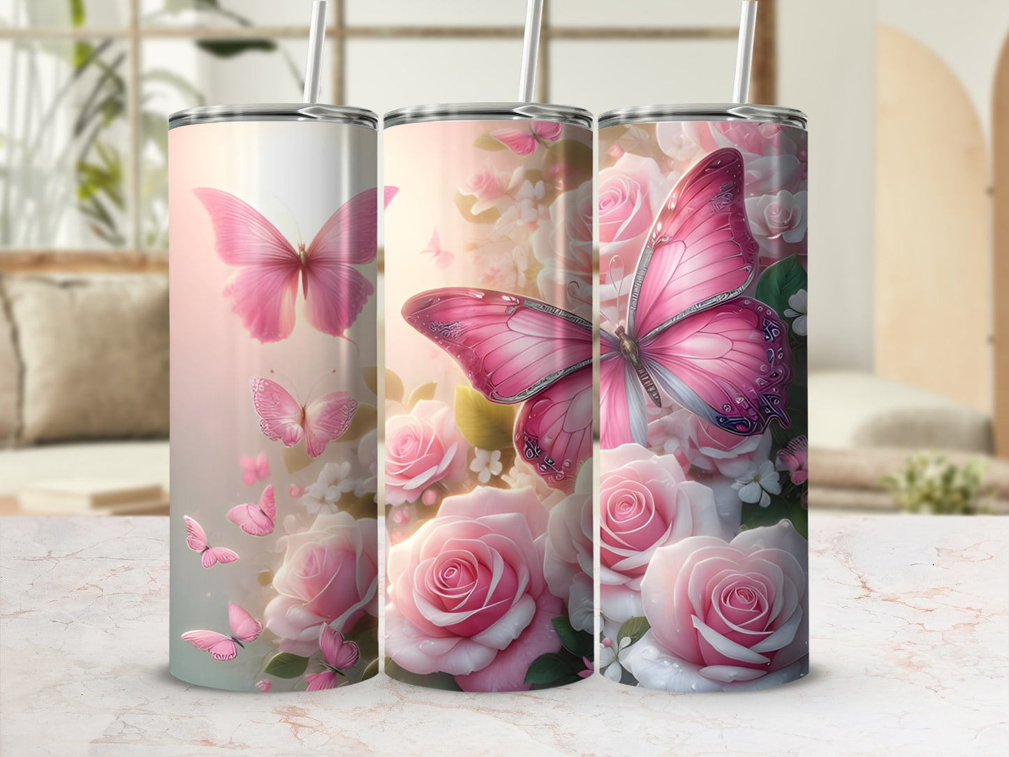 Pink butterflies and roses on a stainless steel tumbler with a straw.