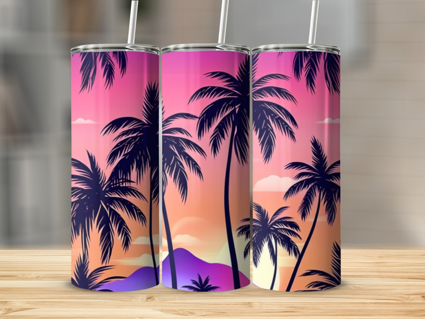 Three tumblers with a tropical sunset and palm tree design.