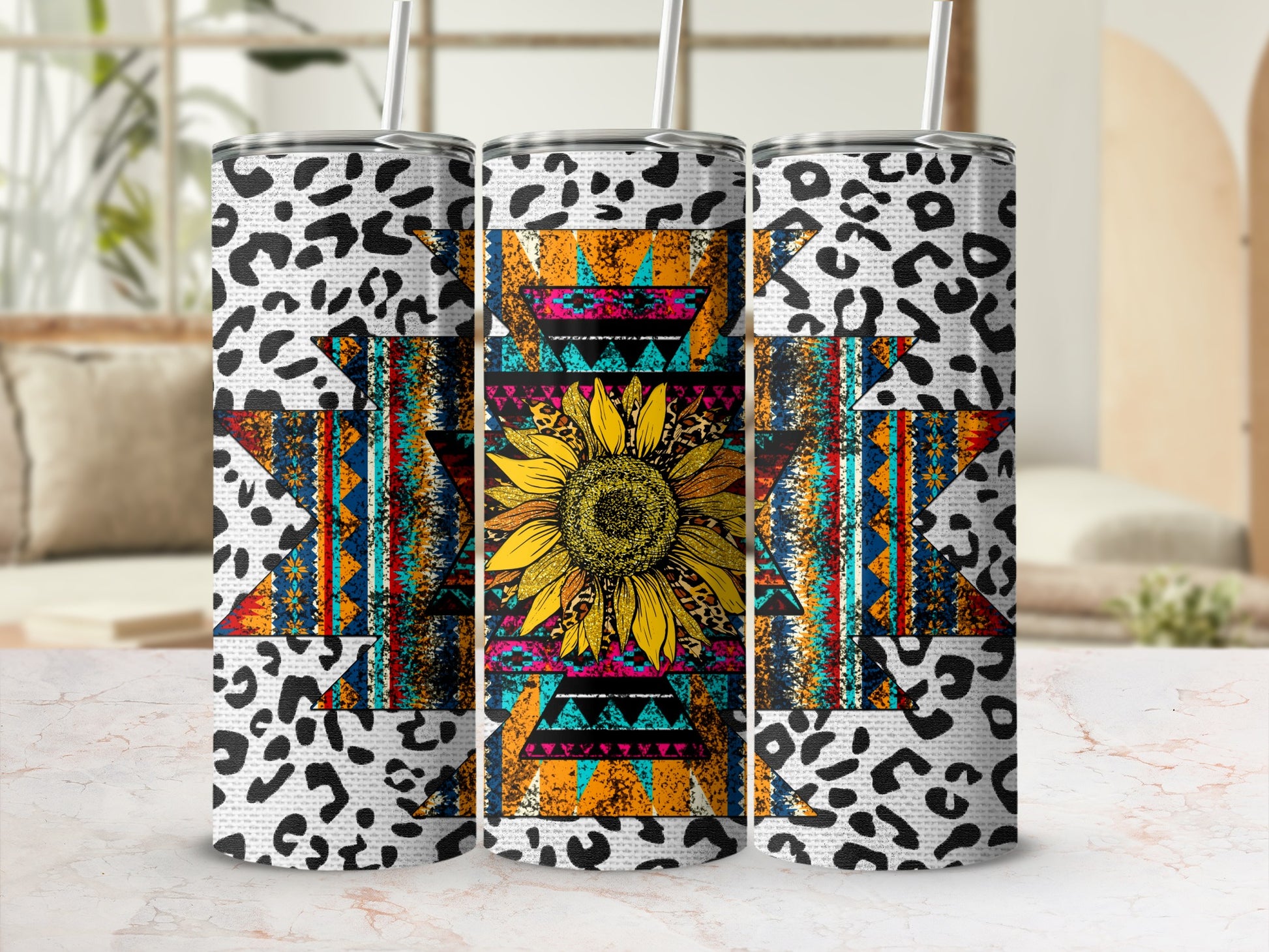 Tumbler with sunflower, leopard print, and geometric Native American patterns.