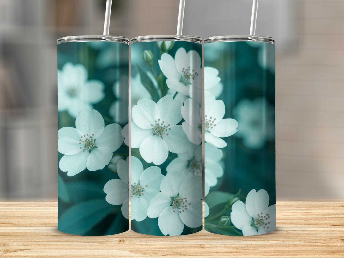 Three tumblers with white flowers and green leaves pattern.
