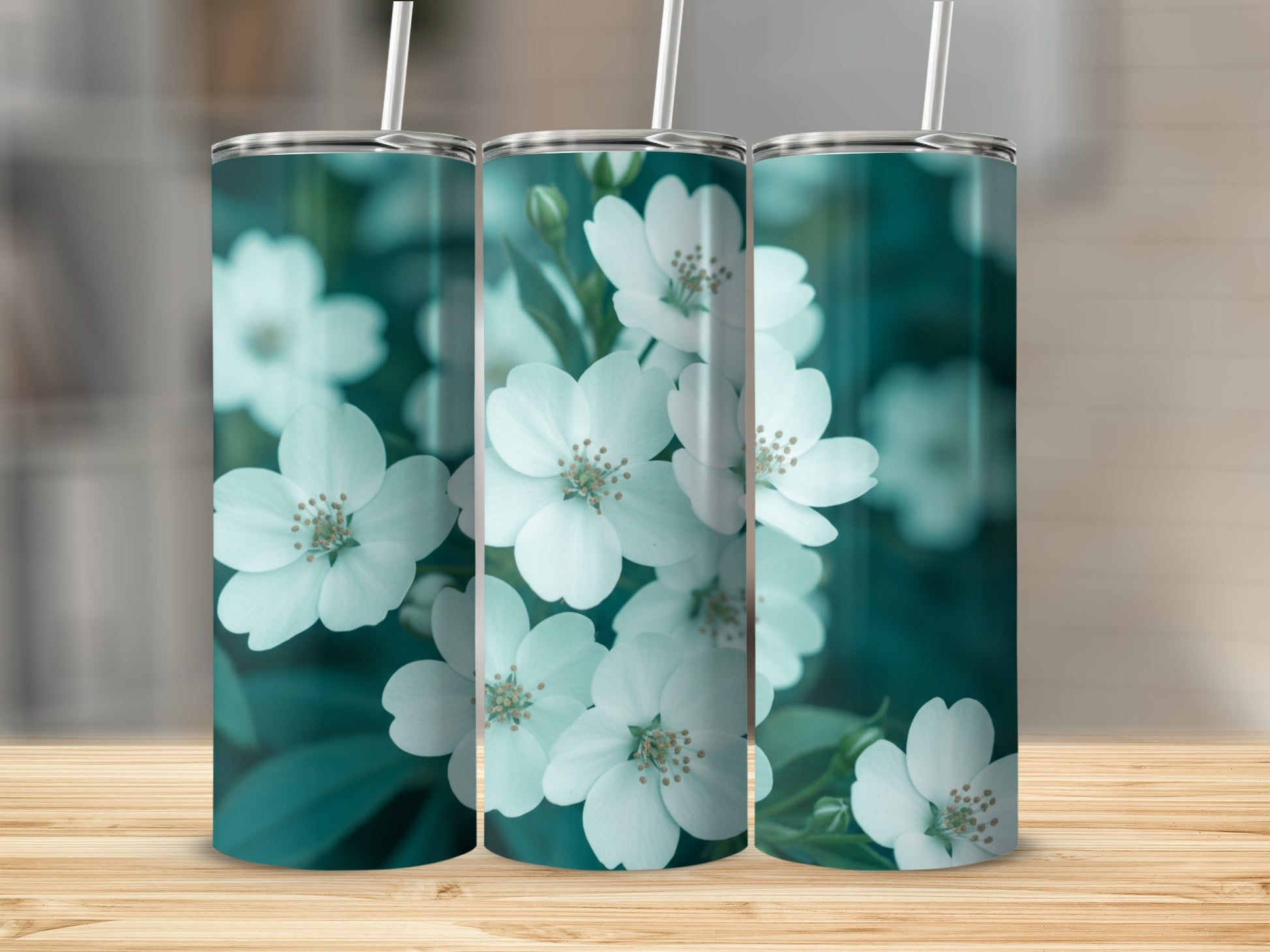 Three tumblers with white flowers and green leaves pattern.