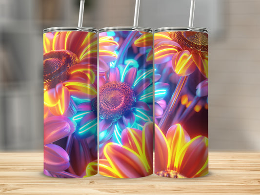 Three tumblers with vibrant, glowing floral designs.