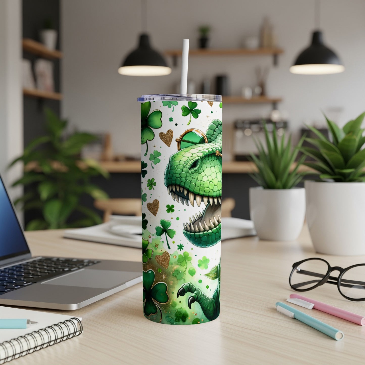 Green dinosaur with sunglasses on a St. Patrick's Day themed tumbler.