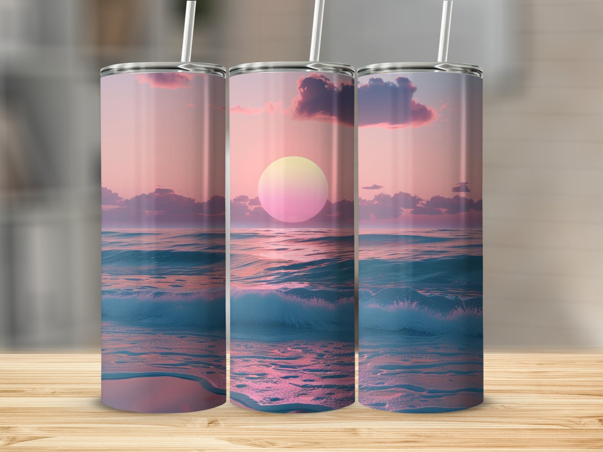 Three tumblers with a sunset ocean wave design.