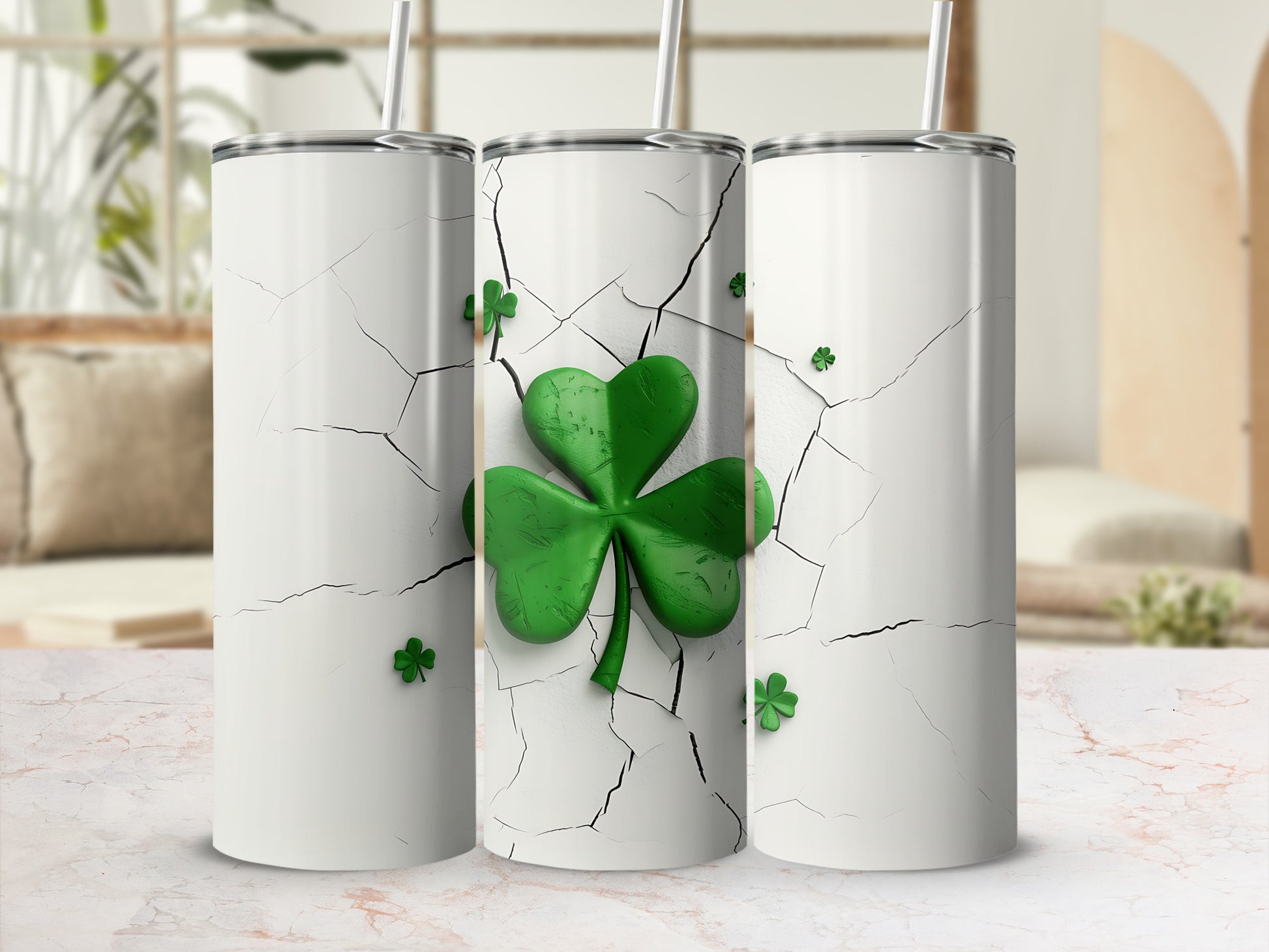 Three white tumblers with cracked white surface and green shamrocks.