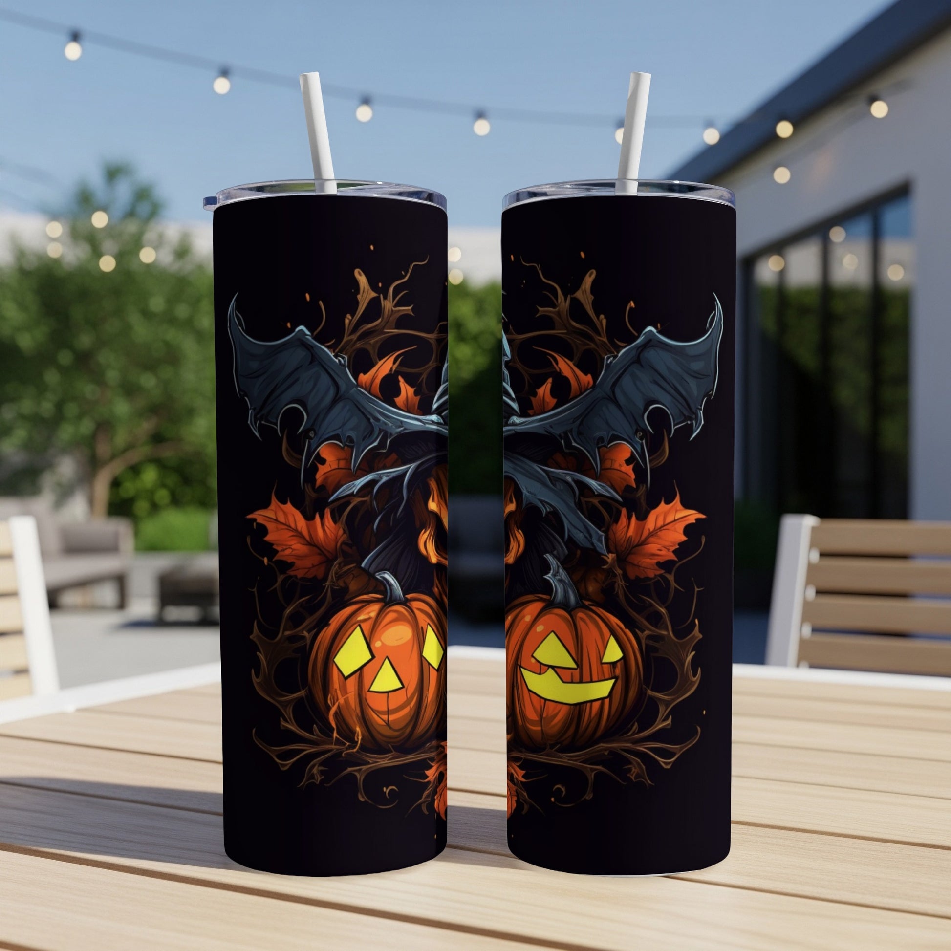 Two tumblers with a spooky Halloween design featuring jack-o'-lanterns and bat wings.