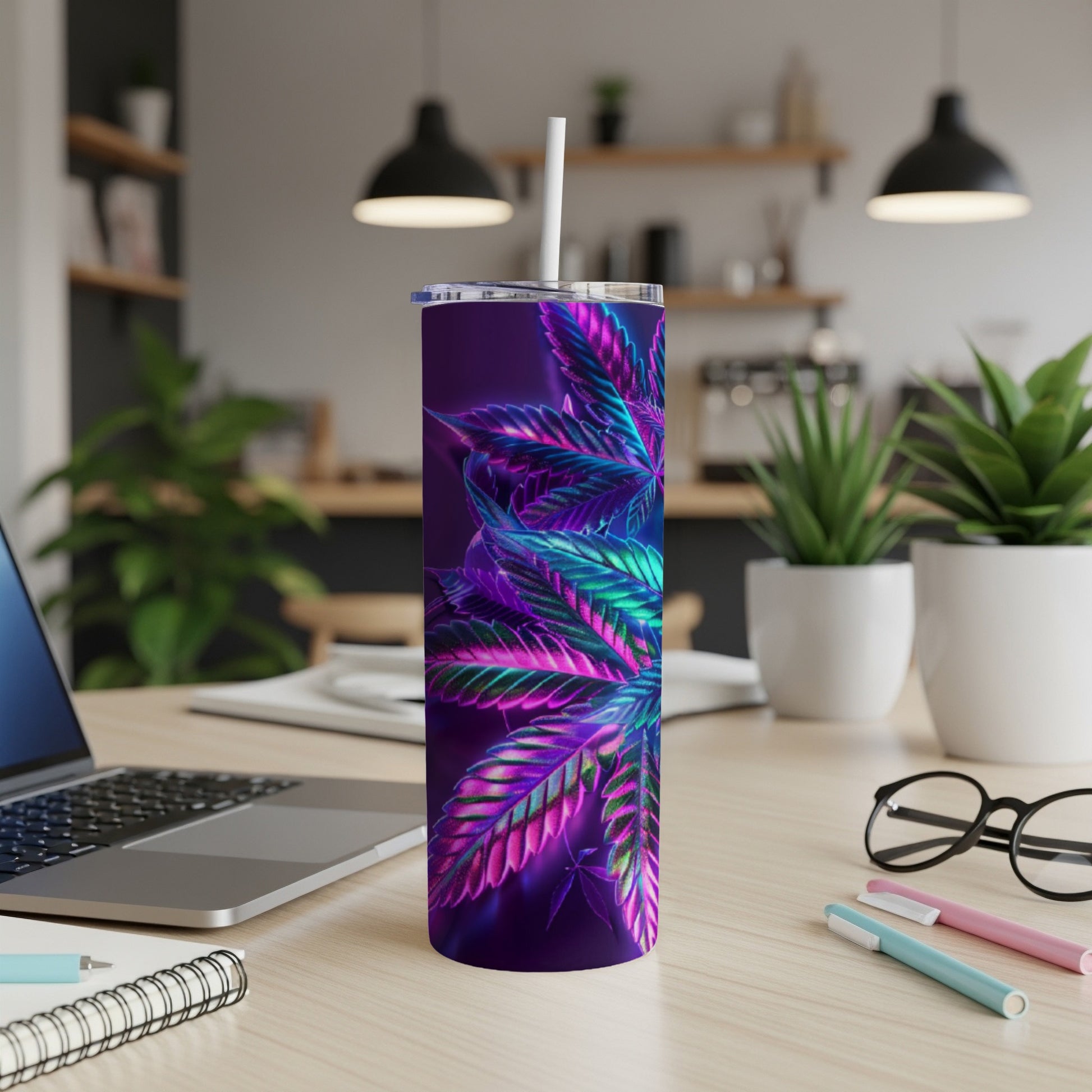 Purple and neon green cannabis leaf pattern on a dark purple skinny tumbler.