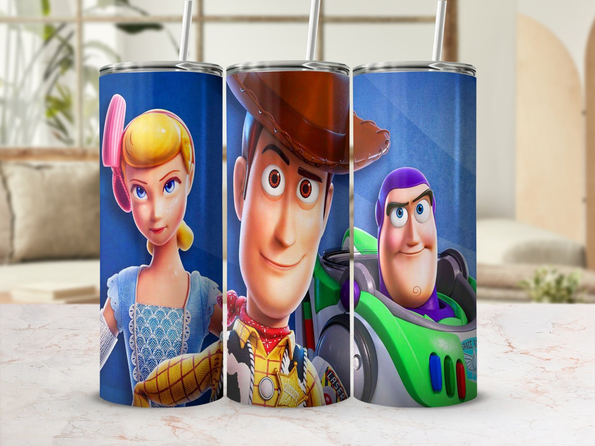 Woody, Bo Peep, and Buzz Lightyear from Toy Story on a blue tumbler.