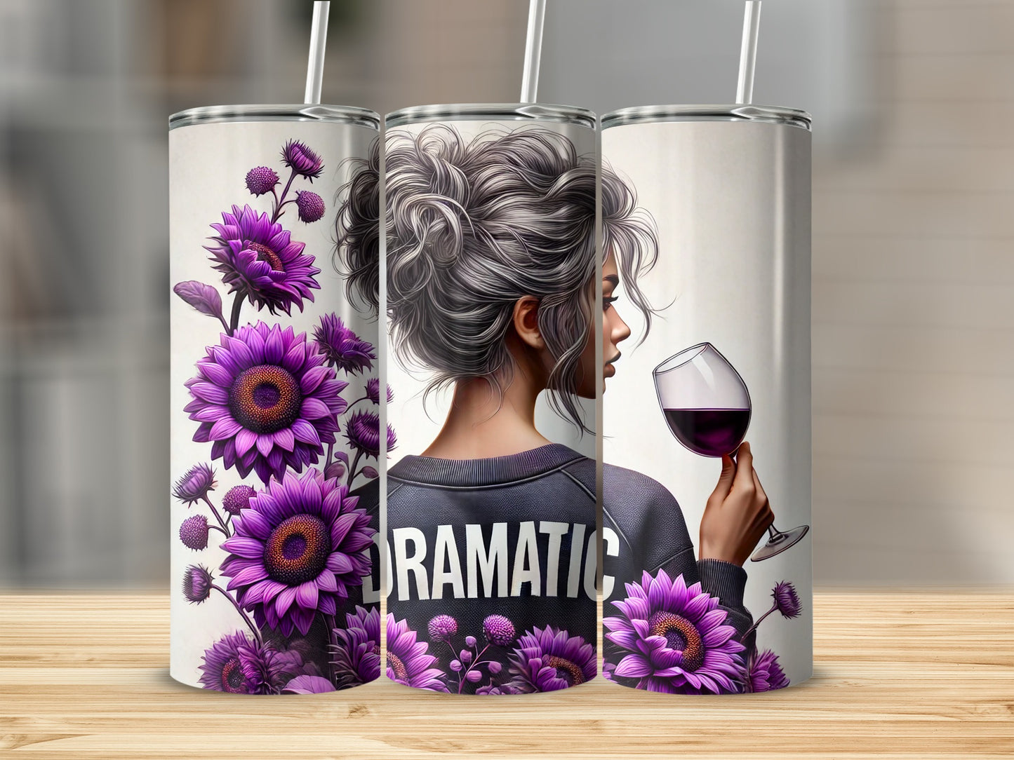 Woman wearing "DRAMATIC" sweatshirt holds a glass of red wine beside purple flowers.