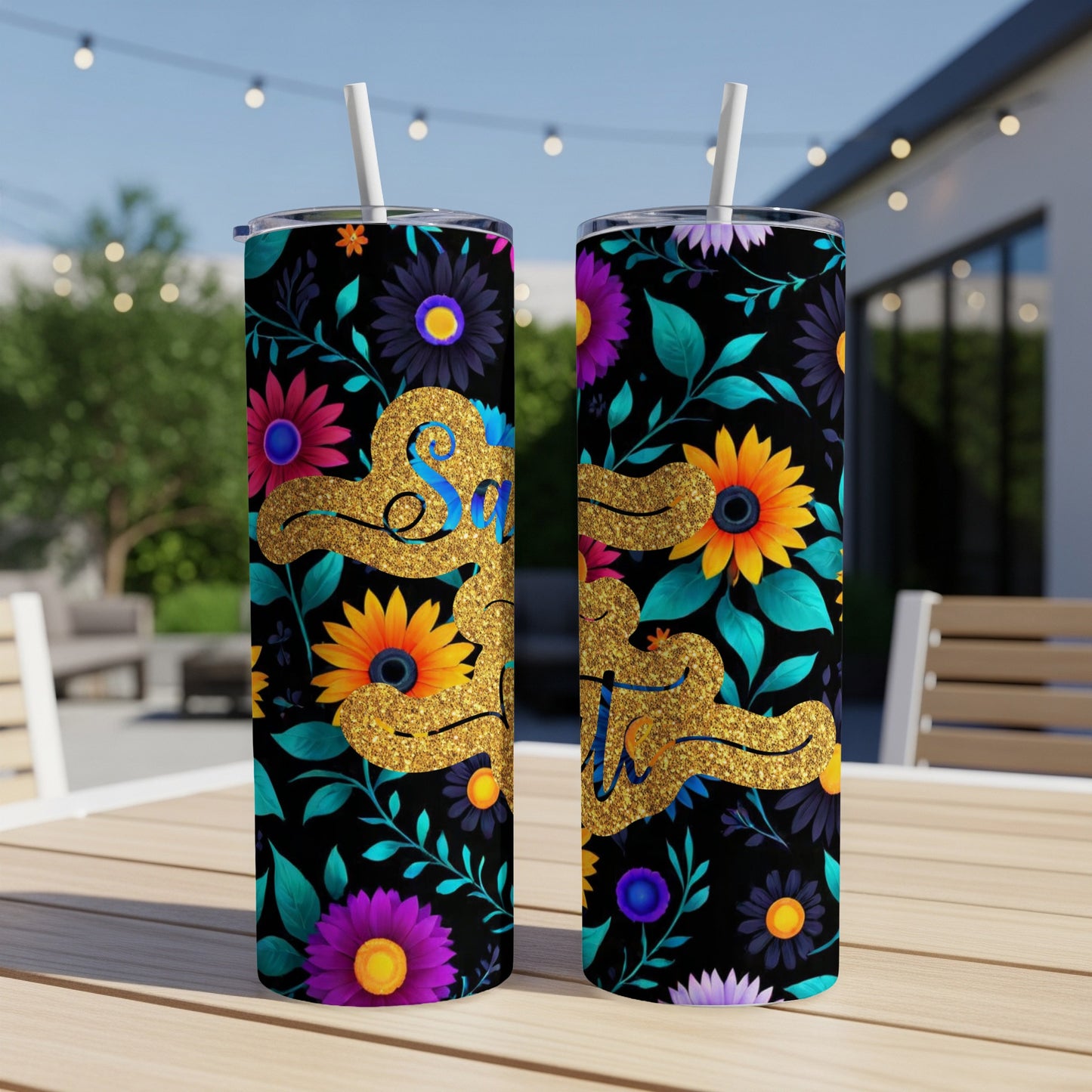 Gold "Sip" text on tumblers with floral and leaf pattern.