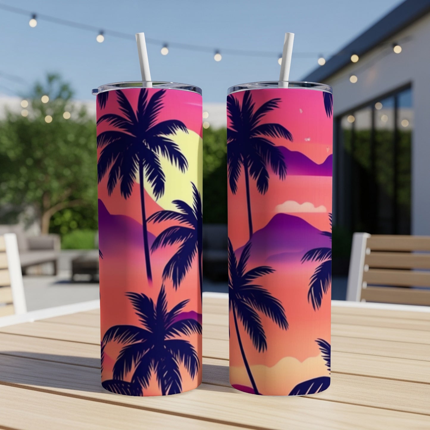 Two tumblers with a tropical sunset and palm tree design.